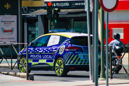 Seville Spain July 09, 2021 Local police patrolling in the streets of Seville, an emblematic city and the capital of the region of Andalusia, in the south of Spainの写真素材