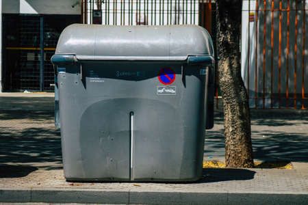 Seville Spain July 10, 2021 Garbage container in the streets of Seville, an emblematic city and the...