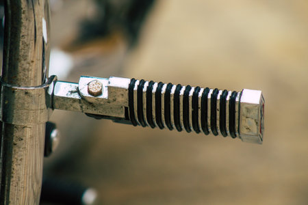 Seville Spain July 12, 2021 Closeup of the mechanics of a motorcycle parked in a parking lot located in the city center of Seville, an emblematic city and the capital of the region of Andalusia, in the south of Spainの写真素材