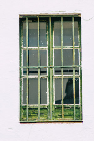 Carmona Spain July 14, 2021 Closeup of a window of a old house in the narrow streets in town of Carmona called The Bright Star of Europe, the town shows a typical narrow and meandering Arabic layoutの写真素材