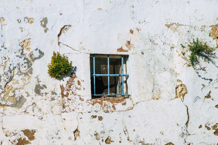 Carmona Spain July 14, 2021 Closeup of a window of a old house in the narrow streets in town of Carmona called The Bright Star of Europe, the town shows a typical narrow and meandering Arabic layoutの写真素材