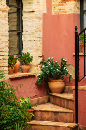 Carmona Spain July 14, 2021 Closeup of a window of a old house in the narrow streets in town of Carmona called The Bright Star of Europe, the town shows a typical narrow and meandering Arabic layoutの写真素材