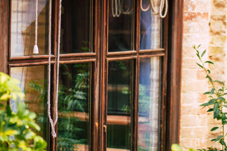 Carmona Spain July 14, 2021 Closeup of a window of a old house in the narrow streets in town of Carmona called The Bright Star of Europe, the town shows a typical narrow and meandering Arabic layoutの写真素材