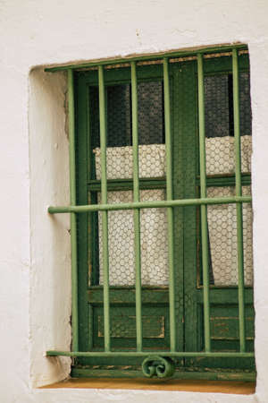 Carmona Spain July 14, 2021 Closeup of a window of a old house in the narrow streets in town of Carmona called The Bright Star of Europe, the town shows a typical narrow and meandering Arabic layoutの写真素材