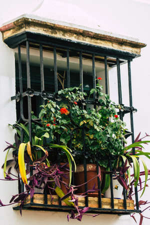 Carmona Spain July 14, 2021 Closeup of a window of a old house in the narrow streets in town of...