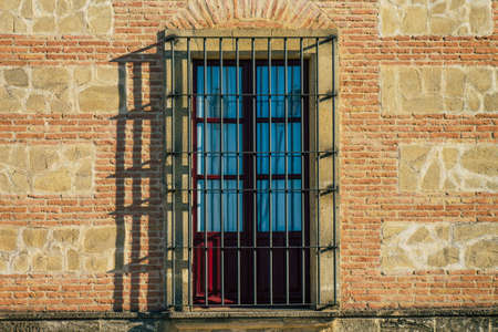 Carmona Spain July 14, 2021 Closeup of a window of a old house in the narrow streets in town of Carmona called The Bright Star of Europe, the town shows a typical narrow and meandering Arabic layoutの写真素材