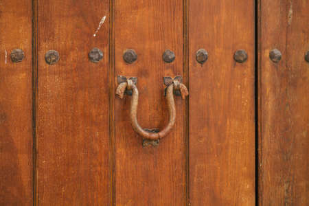 Carmona Spain July 14, 2021 Closeup of a door of a old house in the narrow streets in town of Carmona called The Bright Star of Europe, the town shows a typical narrow and meandering Arabic layoutの写真素材