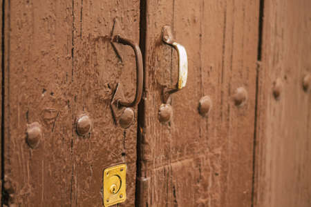 Carmona Spain July 14, 2021 Closeup of a door of a old house in the narrow streets in town of...
