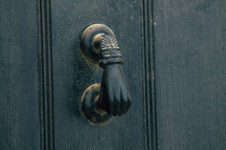 Carmona Spain July 14, 2021 Closeup of a door of a old house in the narrow streets in town of Carmona called The Bright Star of Europe, the town shows a typical narrow and meandering Arabic layoutの写真素材