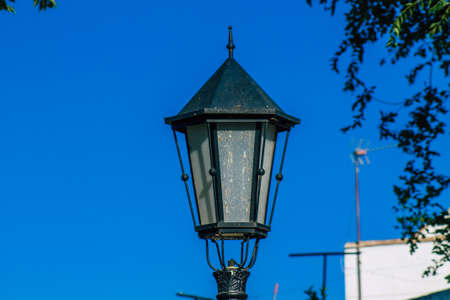Carmona Spain July 15, 2021 Street lamp in the narrow streets in the town of Carmona called The Bright Star of Europe, the town shows a typical narrow and meandering Arabic layoutの写真素材