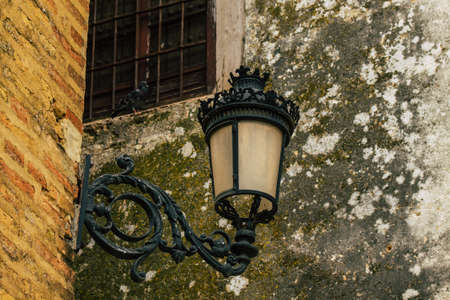 Carmona Spain July 15, 2021 Street lamp in the narrow streets in the town of Carmona called The...