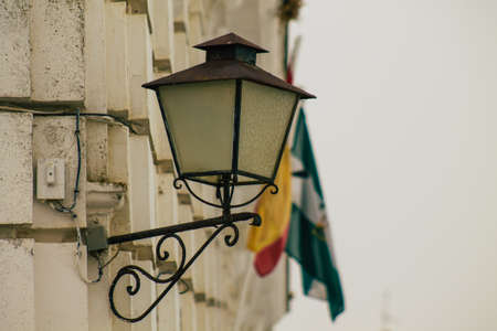 Carmona Spain July 15, 2021 Street lamp in the narrow streets in the town of Carmona called The Bright Star of Europe, the town shows a typical narrow and meandering Arabic layoutの写真素材