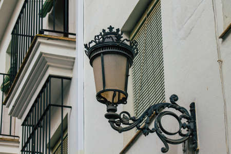 Carmona Spain July 15, 2021 Street lamp in the narrow streets in the town of Carmona called The Bright Star of Europe, the town shows a typical narrow and meandering Arabic layoutの写真素材
