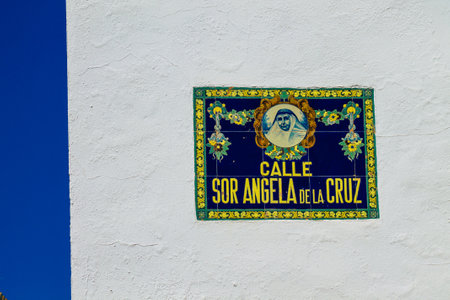 Carmona Spain July 15, 2021 Artistic street sign, erected at the side of or above roads to provide information to road user in the typical narrow and meandering town of Carmona called The Bright Star of Europeの写真素材
