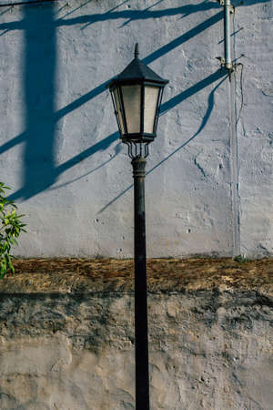 Carmona Spain July 15, 2021 Street lamp in the narrow streets in the town of Carmona called The Bright Star of Europe, the town shows a typical narrow and meandering Arabic layoutの写真素材