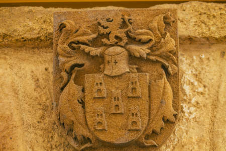 Carmona Spain July 16, 2021 Coat of arms of a old house in the narrow streets in the town of Carmona called The Bright Star of Europe, the town shows a typical narrow and meandering Arabic layoutの写真素材