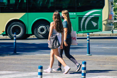 Seville Spain July 09, 2021 Pedestrians walking in the streets of Seville during the coronavirus outbreak hitting Spain, wearing a mask in the street is not mandatoryのeditorial素材