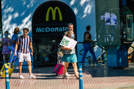 Seville Spain July 09, 2021 Pedestrians walking in the streets of Seville during the  virus outbreak...