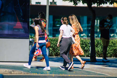 Seville Spain July 09, 2021 Pedestrians walking in the streets of Seville during the  virus outbreak hitting Spain, wearing a mask in the street is not mandatoryのeditorial素材