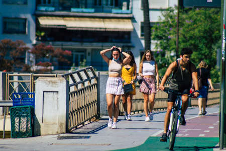 Seville Spain July 09, 2021 Pedestrians walking in the streets of Seville during the coronavirus outbreak hitting Spain, wearing a mask in the street is not mandatoryのeditorial素材