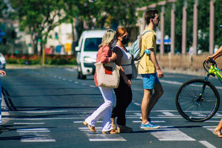 Seville Spain July 09, 2021 Pedestrians walking in the streets of Seville during the coronavirus outbreak hitting Spain, wearing a mask in the street is not mandatoryのeditorial素材