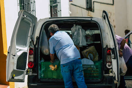 Carmona Spain July 10, 2021 Home bakery delivering bread in the old streets of Carmona in Spain, it is a way to supply the elderly who have difficulty moving, this service is freeのeditorial素材
