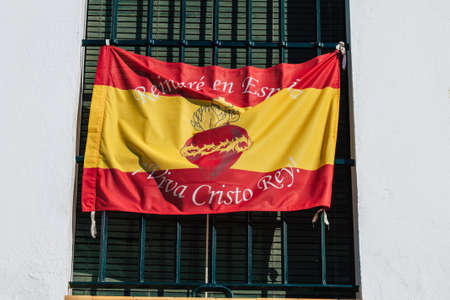 Carmona Spain July 14, 2021 Religious poster at the window of a old house in the narrow streets in town of Carmona, the town shows a typical narrow and meandering Arabic layoutのeditorial素材