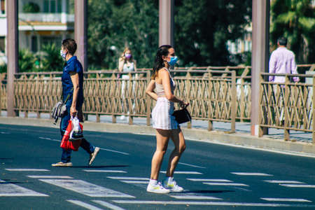 Seville Spain July 09, 2021 Pedestrians walking in the streets of Seville during the coronavirus...