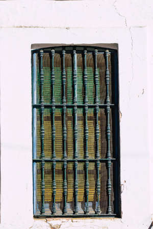 Carmona Spain July 14, 2021 Closeup of a window of a old house in the narrow streets in town of...