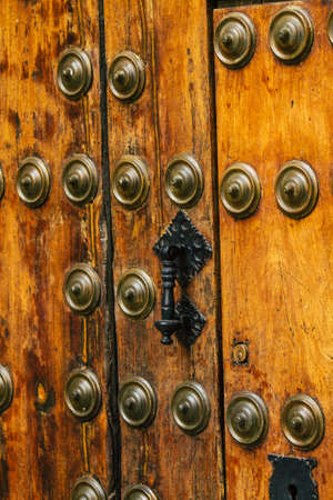 Carmona Spain July 14, 2021 Closeup of a door of a old house in the narrow streets in town of Carmona called The Bright Star of Europe, the town shows a typical narrow and meandering Arabic layoutのeditorial素材