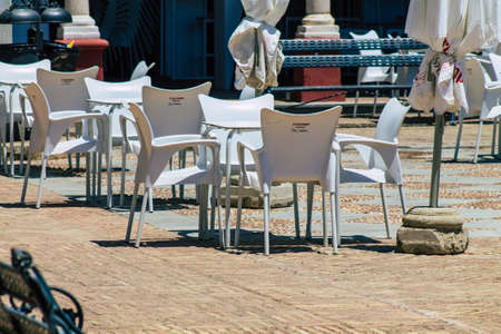 Carmona Spain July 14, 2021 Table and chairs in the streets of Carmona called The Bright Star of Europe, the town shows a typical narrow and meandering Arabic layoutのeditorial素材