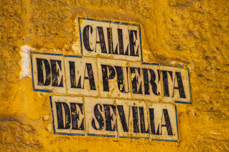 Carmona Spain July 15, 2021 Artistic street sign, erected at the side of or above roads to provide information to road user in the typical narrow and meandering town of Carmona called The Bright Star of Europeのeditorial素材