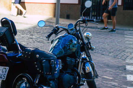 Seville Spain July 14, 2021 Closeup of the mechanics of a motorcycle parked in a parking lot located in the city center of Seville, an emblematic city and the capital of the region of Andalusia, in the south of Spainのeditorial素材