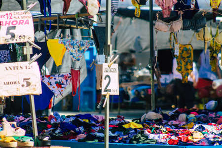 Carmona Spain July 19, 2021 Various summer clothes sold at the local market in downtown during Coronavirus outbreak hitting Spain, wearing a mask is mandatoryのeditorial素材