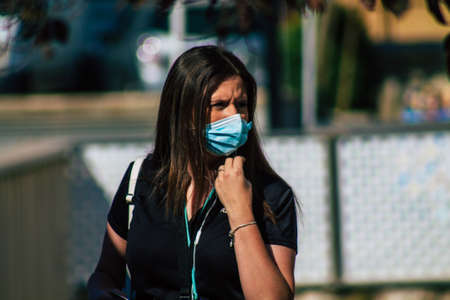 Carmona Spain July 18, 2021 Pedestrian walking in the streets of Carmona during the coronavirus outbreak hitting Spain, wearing a mask in the street is not mandatoryのeditorial素材