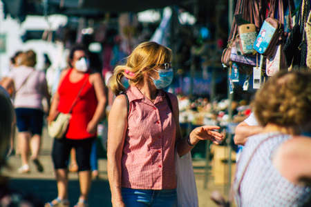 Carmona Spain July 19, 2021 Unidentified Spanish people with face mask shopping at local market in downtown during Coronavirus outbreak hitting Spain, wearing a mask is mandatoryのeditorial素材