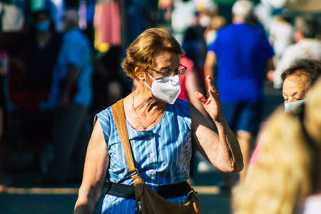 Carmona Spain July 19, 2021 Unidentified Spanish people with face mask shopping at local market in downtown during Coronavirus outbreak hitting Spain, wearing a mask is mandatoryのeditorial素材