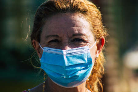 Carmona Spain July 19, 2021 Unidentified Spanish people with face mask shopping at local market in downtown during Coronavirus outbreak hitting Spain, wearing a mask is mandatoryのeditorial素材