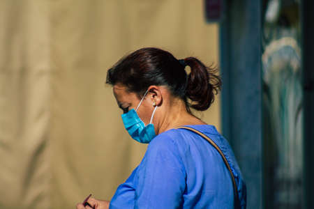 Carmona Spain July 18, 2021 Pedestrian walking in the streets of Carmona during the coronavirus outbreak hitting Spain, wearing a mask in the street is not mandatoryのeditorial素材