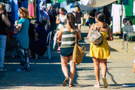 Carmona Spain July 19, 2021 Unidentified Spanish people with face mask shopping at local market in downtown during Coronavirus outbreak hitting Spain, wearing a mask is mandatoryのeditorial素材