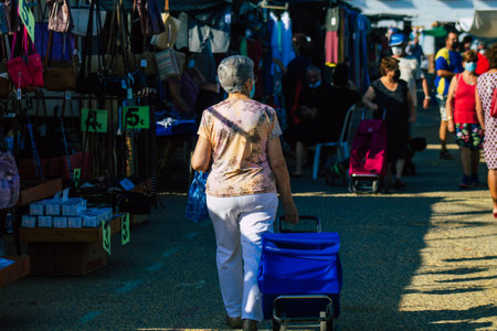 Carmona Spain July 19, 2021 Unidentified Spanish people with face mask shopping at local market in downtown during Coronavirus outbreak hitting Spain, wearing a mask is mandatoryのeditorial素材