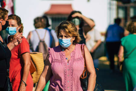Carmona Spain July 19, 2021 Unidentified Spanish people with face mask shopping at local market in downtown during Coronavirus outbreak hitting Spain, wearing a mask is mandatoryのeditorial素材