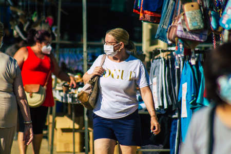 Carmona Spain July 19, 2021 Unidentified Spanish people with face mask shopping at local market in downtown during Coronavirus outbreak hitting Spain, wearing a mask is mandatoryのeditorial素材