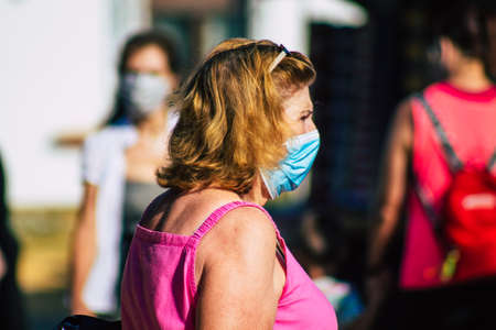 Carmona Spain July 19, 2021 Unidentified Spanish people with face mask shopping at local market in downtown during Coronavirus outbreak hitting Spain, wearing a mask is mandatoryのeditorial素材