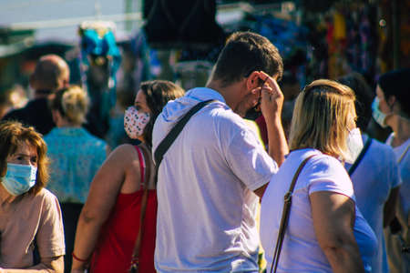 Carmona Spain July 19, 2021 Unidentified Spanish people with face mask shopping at local market in downtown during Coronavirus outbreak hitting Spain, wearing a mask is mandatoryのeditorial素材