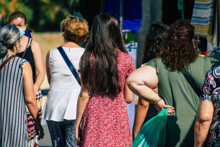 Carmona Spain July 19, 2021 Unidentified Spanish people with face mask shopping at local market in downtown during Coronavirus outbreak hitting Spain, wearing a mask is mandatoryのeditorial素材