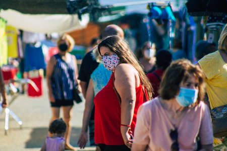 Carmona Spain July 19, 2021 Unidentified Spanish people with face mask shopping at local market in downtown during Coronavirus outbreak hitting Spain, wearing a mask is mandatoryのeditorial素材