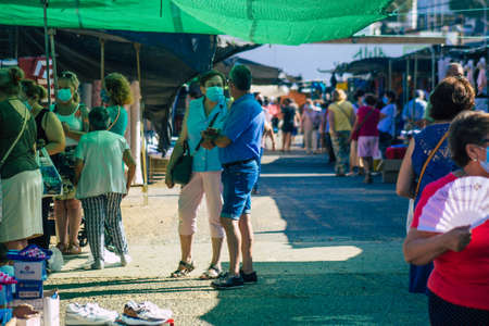 Carmona Spain July 19, 2021 Unidentified Spanish people with face mask shopping at local market in downtown during Coronavirus outbreak hitting Spain, wearing a mask is mandatoryのeditorial素材