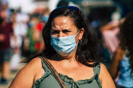 Carmona Spain July 19, 2021 Unidentified Spanish people with face mask shopping at local market in downtown during Coronavirus outbreak hitting Spain, wearing a mask is mandatoryのeditorial素材