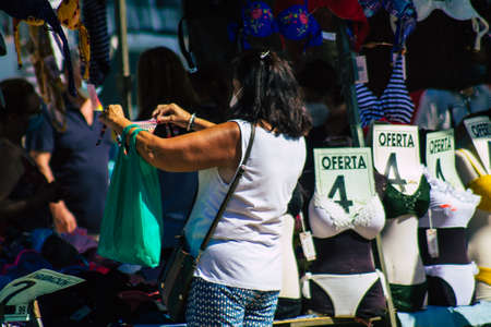 Carmona Spain July 19, 2021 Unidentified Spanish people with face mask shopping at local market in downtown during Coronavirus outbreak hitting Spain, wearing a mask is mandatoryのeditorial素材